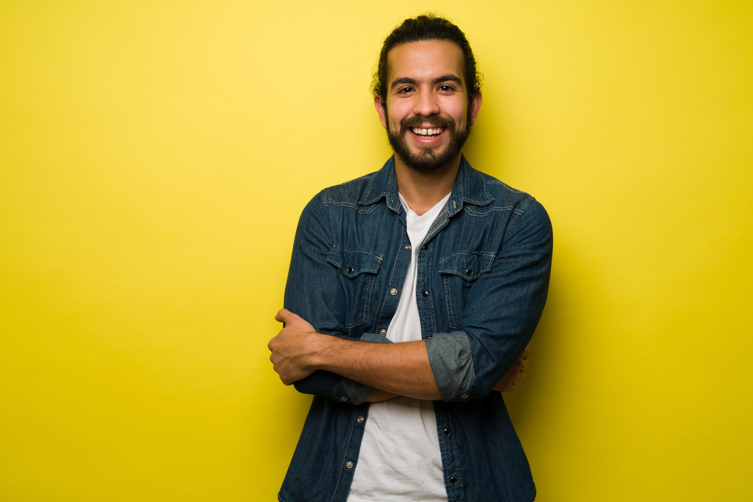 Excited latin man laughing